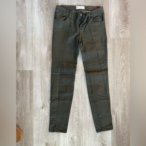 Green Free People coated skinny jeans. Size 25.
